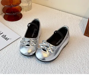 Close-up detail of silver girls' Mary Jane shoes with stylish double bow decoration
