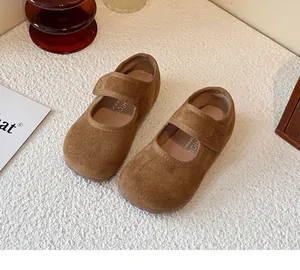 Detailed shot of children's brown suede Mary Jane shoes with velcro strap for spring