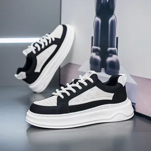 Detailed macro view of black and white breathable leather sneakers with thick platform soles
