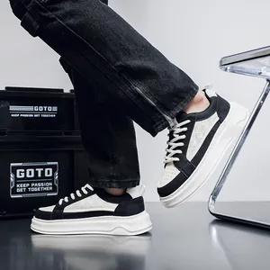 Detailed side view of men's thick-sole leather sneakers in black and white contrast color