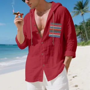 Close-up detail of red bohemian linen hoodie shirt featuring a colorful striped chest pocket.