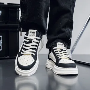 Macro view of men's breathable black and white leather chunky board shoes on feet