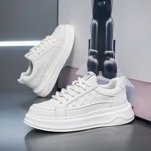 Side view of white leather platform sneakers with breathable perforated patterns