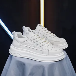 Macro view of white thick-soled breathable leather sneakers for casual spring wear
