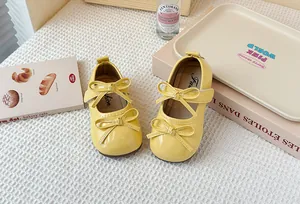 Yellow patent leather Mary Jane shoes for girls with double bow and velcro straps