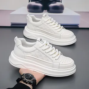 Close-up of white platform sneakers for men with breathable perforated leather details