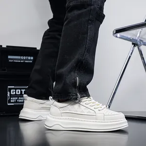 Detail of breathable white leather sneakers for men with thick sole and geometric pattern