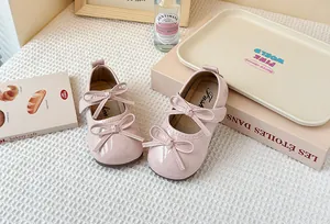 Detailed view of pink girls Mary Jane shoes featuring elegant double decorative bows