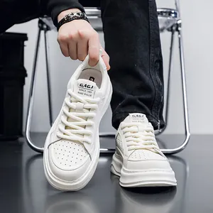 Detail of white leather platform sneakers showing breathable design and thick sole
