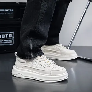 Side view of white platform sneakers for men with breathable perforated details