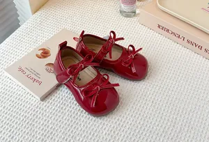 Shiny red patent leather Mary Jane shoes for girls with elegant double bows