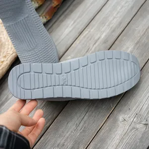 Detailed bottom view of grey fly-knit walking shoe with non-slip sole and size 37 mark