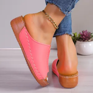 Stylish pink open-toe wedge platform slippers for women in a casual home setting.