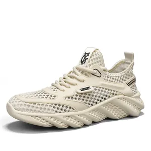 Detail view of cream white breathable mesh sneakers with chunky traction sole