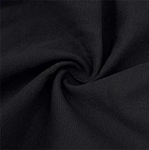 Detailed close-up showing the breathable texture of black linen fabric for men's shorts