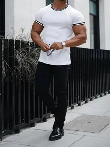 Professional fitness model wearing white ribbed t-shirt with striped trim details