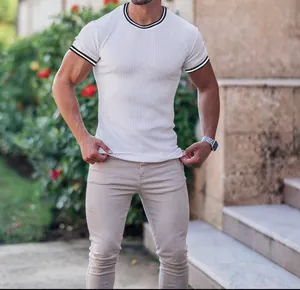 Close-up of white ribbed men's T-shirt with striped collar and cuffs for fitness