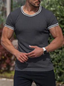 Detail shot of men's dark grey ribbed slim fit T-shirt with striped trim