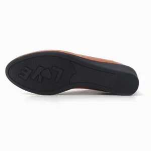 Detailed view of non-slip rubber sole with LOVE pattern on brown pointed wedge flats