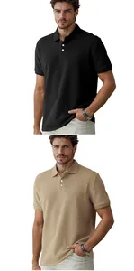 Close-up view of men's polo shirts in black and beige featuring a textured jacquard pattern