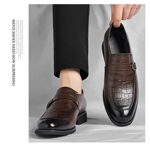 Detail of brown crocodile pattern men's business casual loafers with monk strap buckle