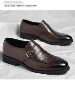 Detailed close-up of brown crocodile texture men's leather loafers with a buckle