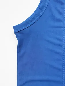 Detail shot of the ribbed knit fabric and shoulder stitching on a blue men's tank top