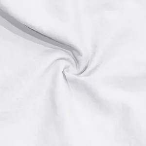 Close-up view showing the soft white cotton fabric texture of men's athletic sports shorts