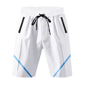 Detailed view of white athletic shorts with blue stripes and zipper pockets