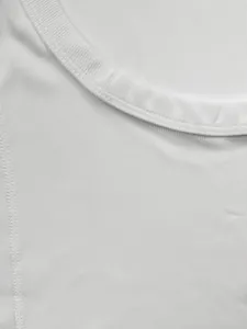 Macro detail of white ribbed knit fabric on men's slim fit sports tank top