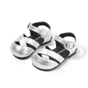 Chic silver metallic toddler girl sandals with closed-toe cross-strap design for summer