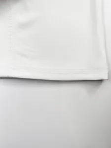 Close-up of white ribbed fabric and double-needle stitching on men's sport tank top