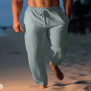 Comfortable men's linen beach pants featuring a drawstring waist in light blue grey