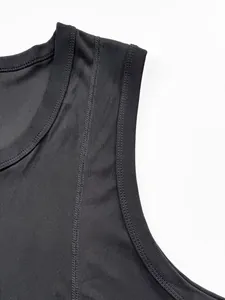 Close-up of black ribbed fabric and shoulder seam on a men's fitness tank top.