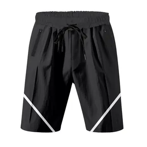 Detailed view of black men's athletic shorts featuring white diagonal stripe accents