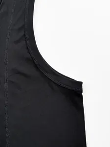 Close-up detail of black ribbed knit sports tank top showing seam and texture