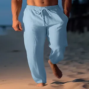 Light blue men's linen beach trousers with drawstring elastic waist and straight leg fit