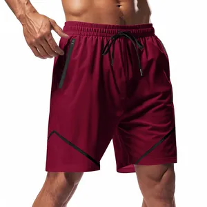 Close-up of maroon men's athletic shorts with black zipper pocket and drawstring