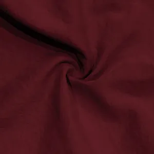 Close-up view of the soft burgundy fabric texture of these men's casual sports shorts.