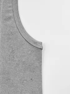 Close-up of grey knitted ribbed fabric on a men's sleeveless fitness tank top detail view.