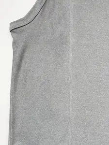 Close-up of gray ribbed knit fabric and flatlock stitching on men's athletic tank top