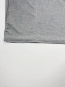Close-up of grey ribbed knit fabric and neat hem stitching of a men's tank top