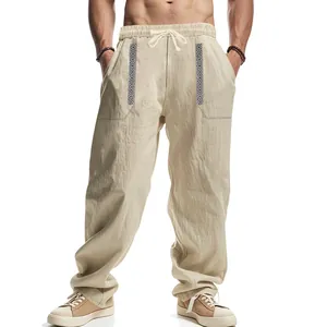 Loose fit men's linen casual pants with ethnic bohemian pattern detailing