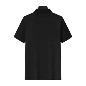 Back view of a men's black waffle knit polo shirt showing detailed fabric texture