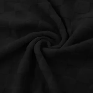 Primer plano de la textura de tela jacquard negra de alta calidad con patrón de cuadros.