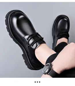 Close-up of black chunky sole Derby shoes featuring round toe and lace-up