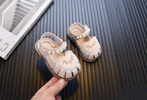 Pink infant walking sandals with embroidered heart, pearls and soft soles for girls