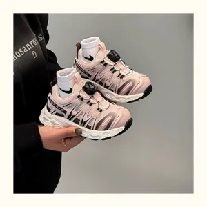 Close-up detail of pink children's sneakers featuring a quick-release rotating buckle