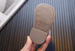 Close-up of the non-slip soft sole of baby princess sandals with size 15 engraving