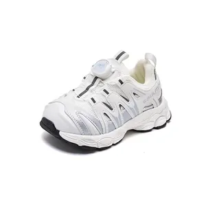 Breathable white children's sneakers featuring a rotating buckle closure and chunky sole